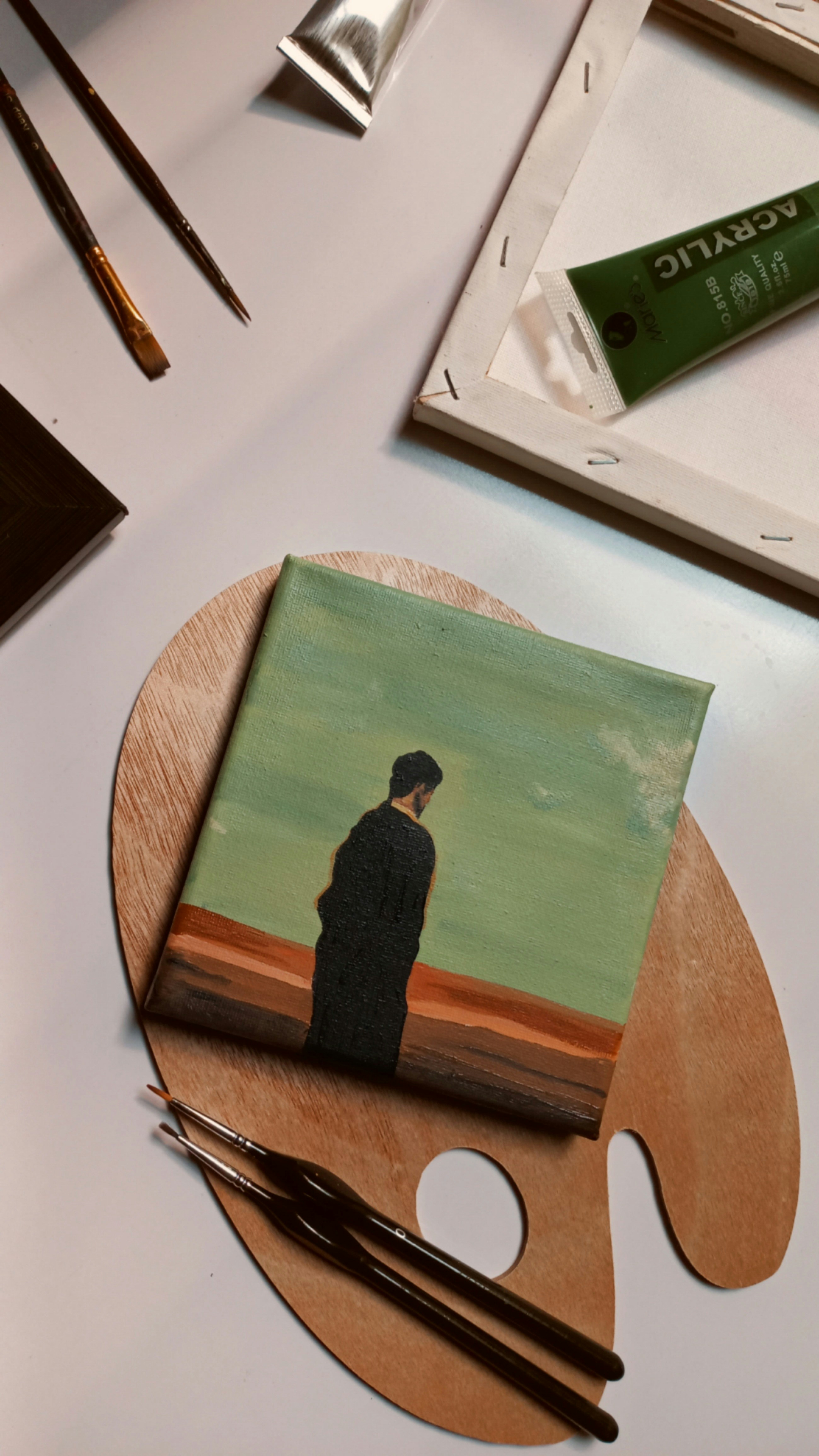 a painting of a man standing on a beach