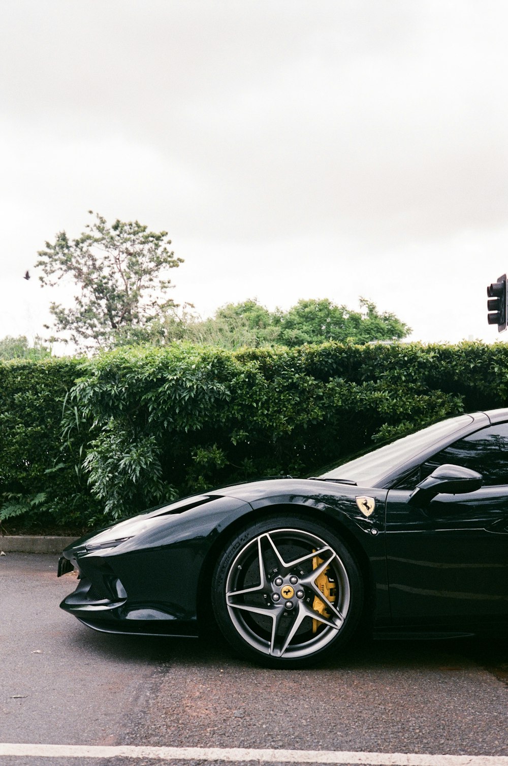 a black sports car parked on the side of the road