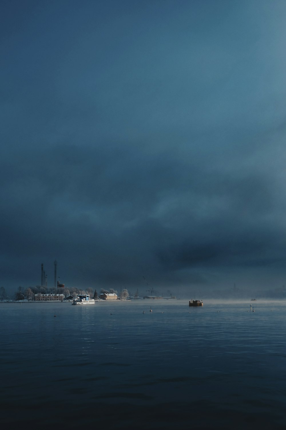 a large body of water under a cloudy sky