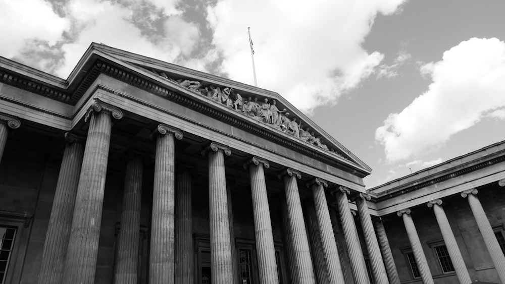 a black and white photo of a building with columns