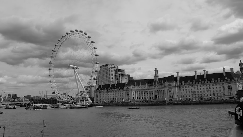 a black and white photo of a ferris wheel