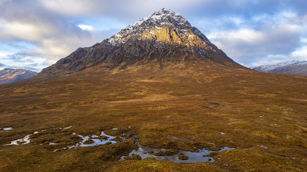 a very tall mountain with a snow covered top