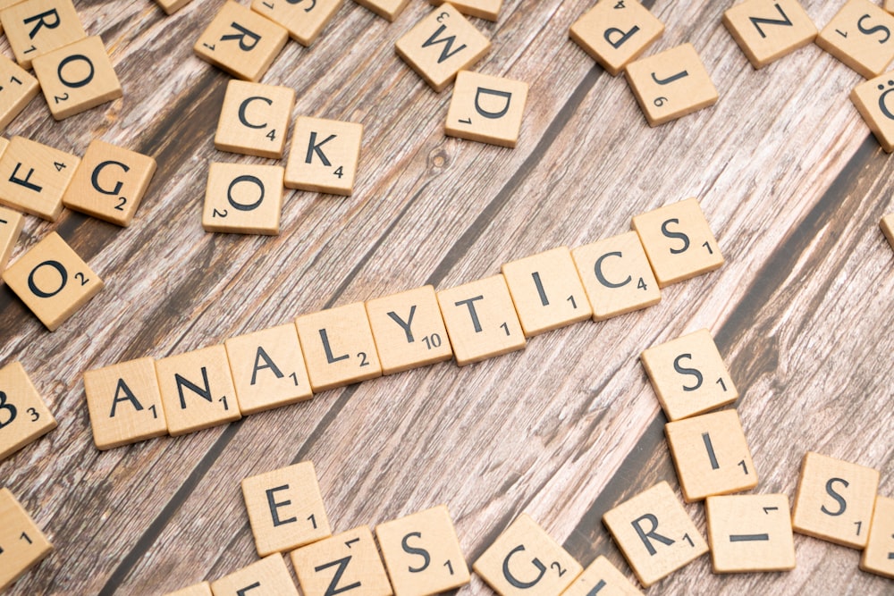 scrabble tiles spelling out the word statistics on a wooden surface