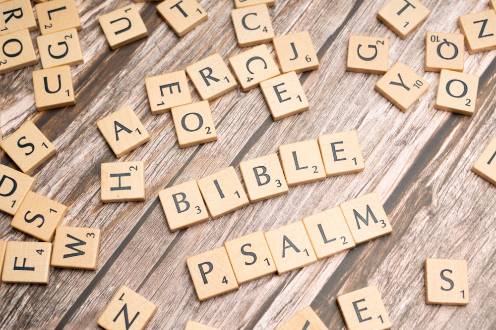 scrabble tiles spelling the names of the bible