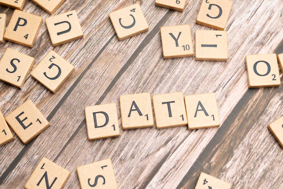 scrabble tiles spelling out the word data on a wooden surface, Data