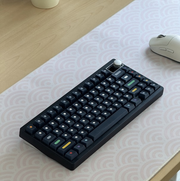 a computer keyboard sitting on top of a table