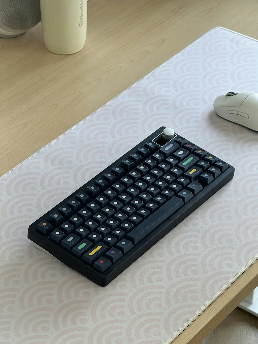 a computer keyboard sitting on top of a table