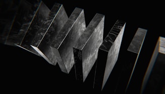 a black and white photo of a number of metal objects