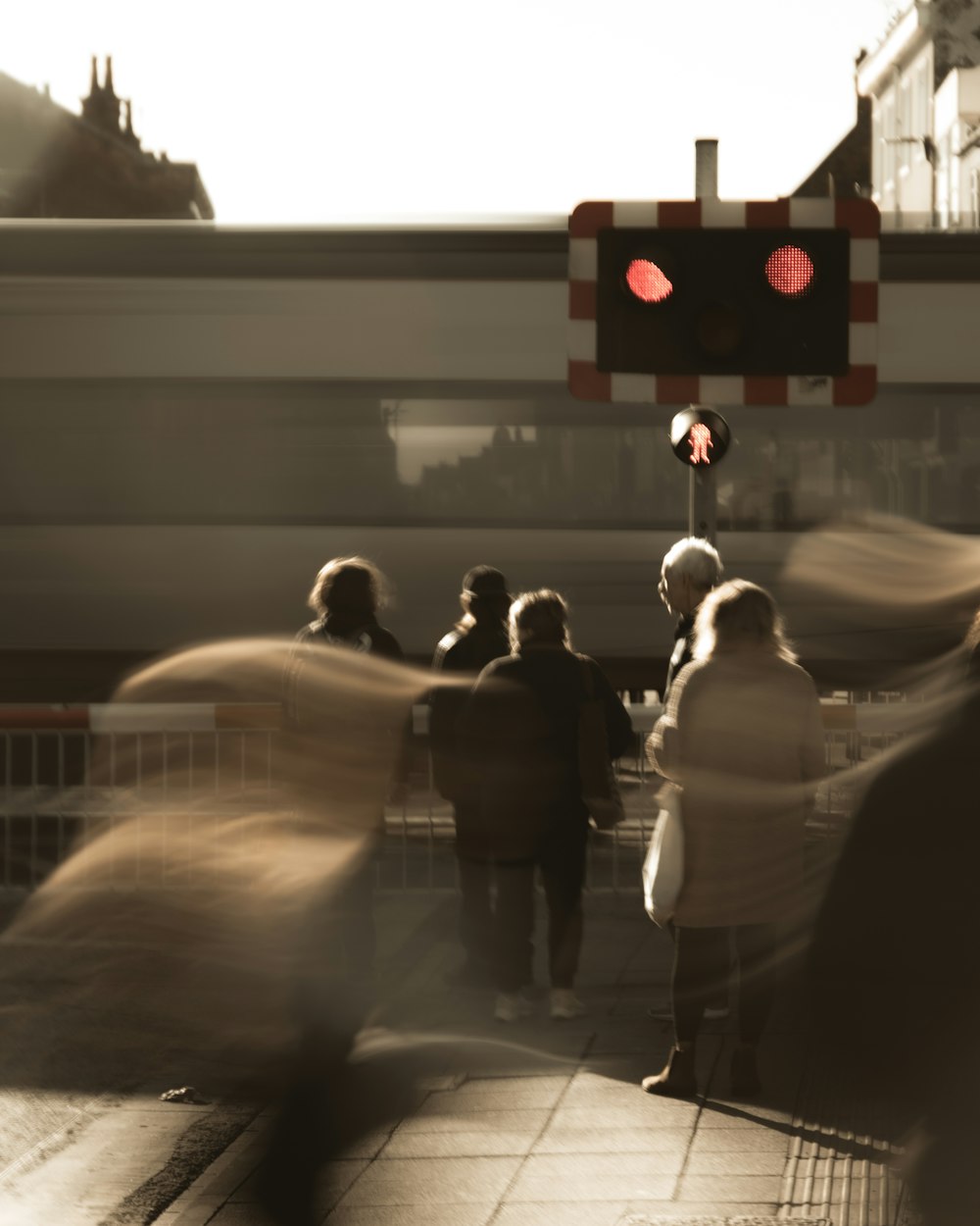 a blurry photo of people waiting at a train station