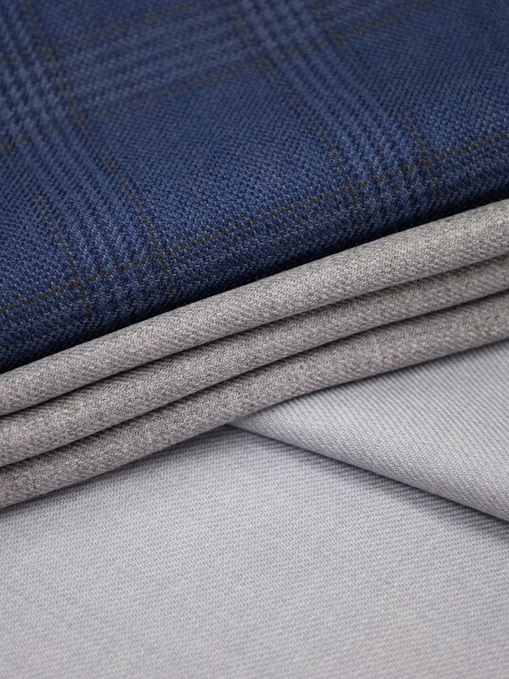 a close up of a blue and grey fabric