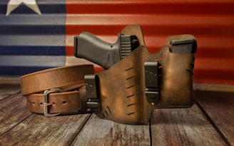 a leather belt with a gun inside of it