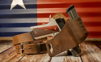 a leather belt with a gun inside of it