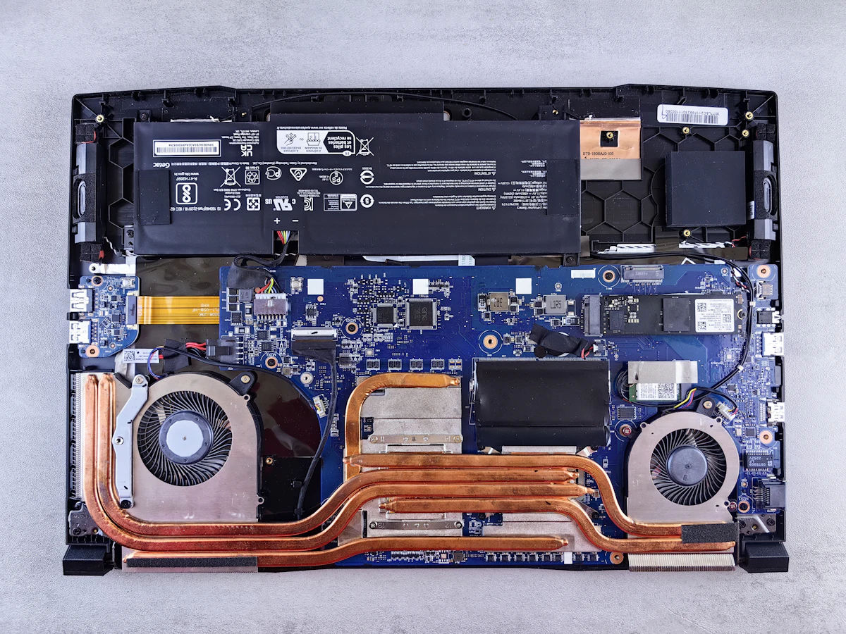 The motherboard of a laptop being dismantled