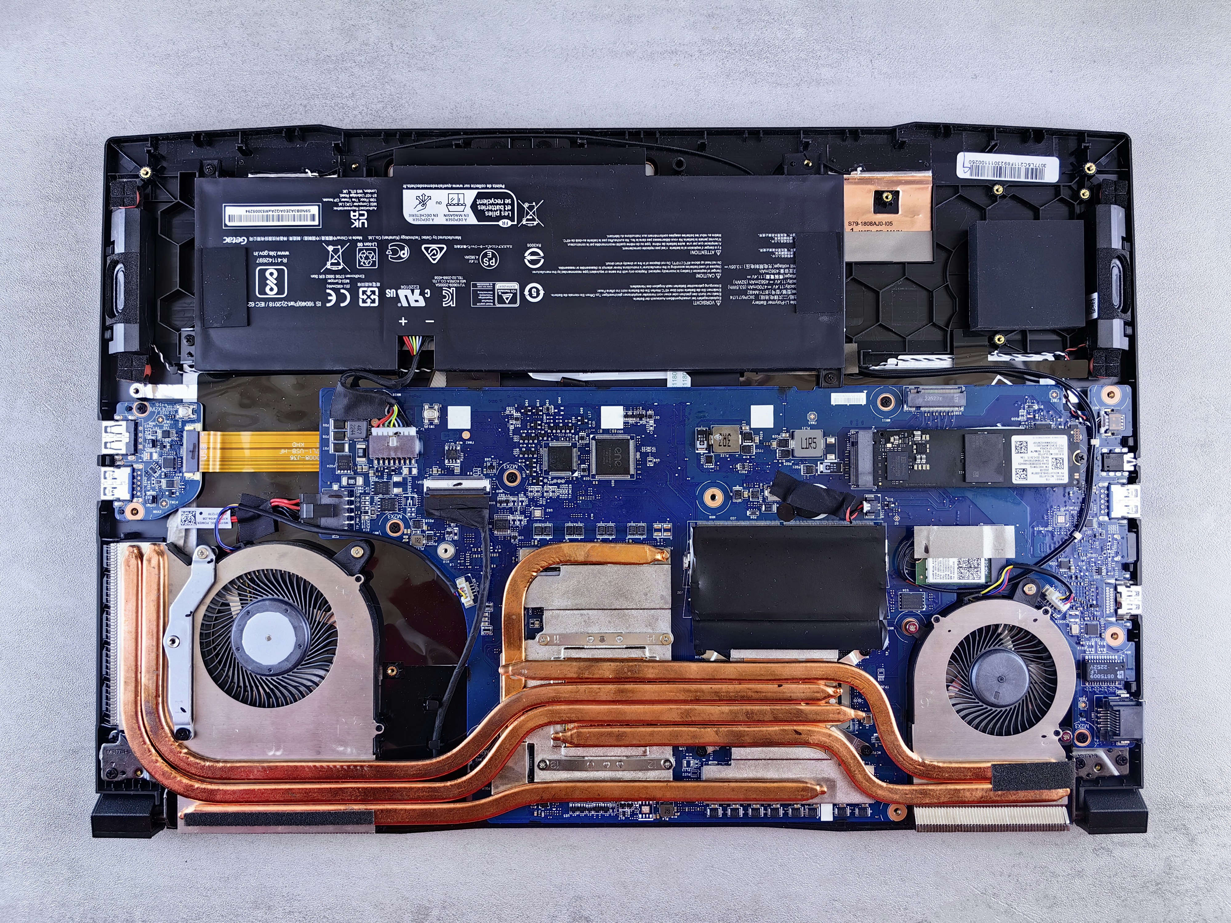 consumer electronics repair shop disassembled laptop internal parts