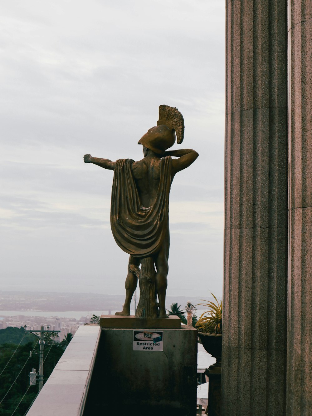 a statue of a roman soldier on a pedestal