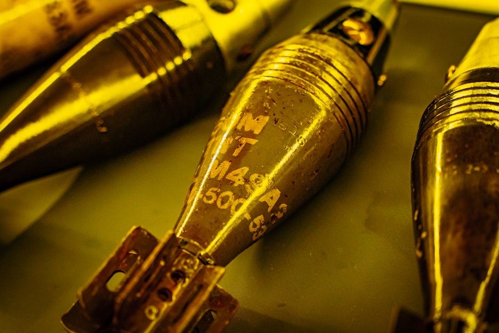 a close up of a bunch of pens on a table