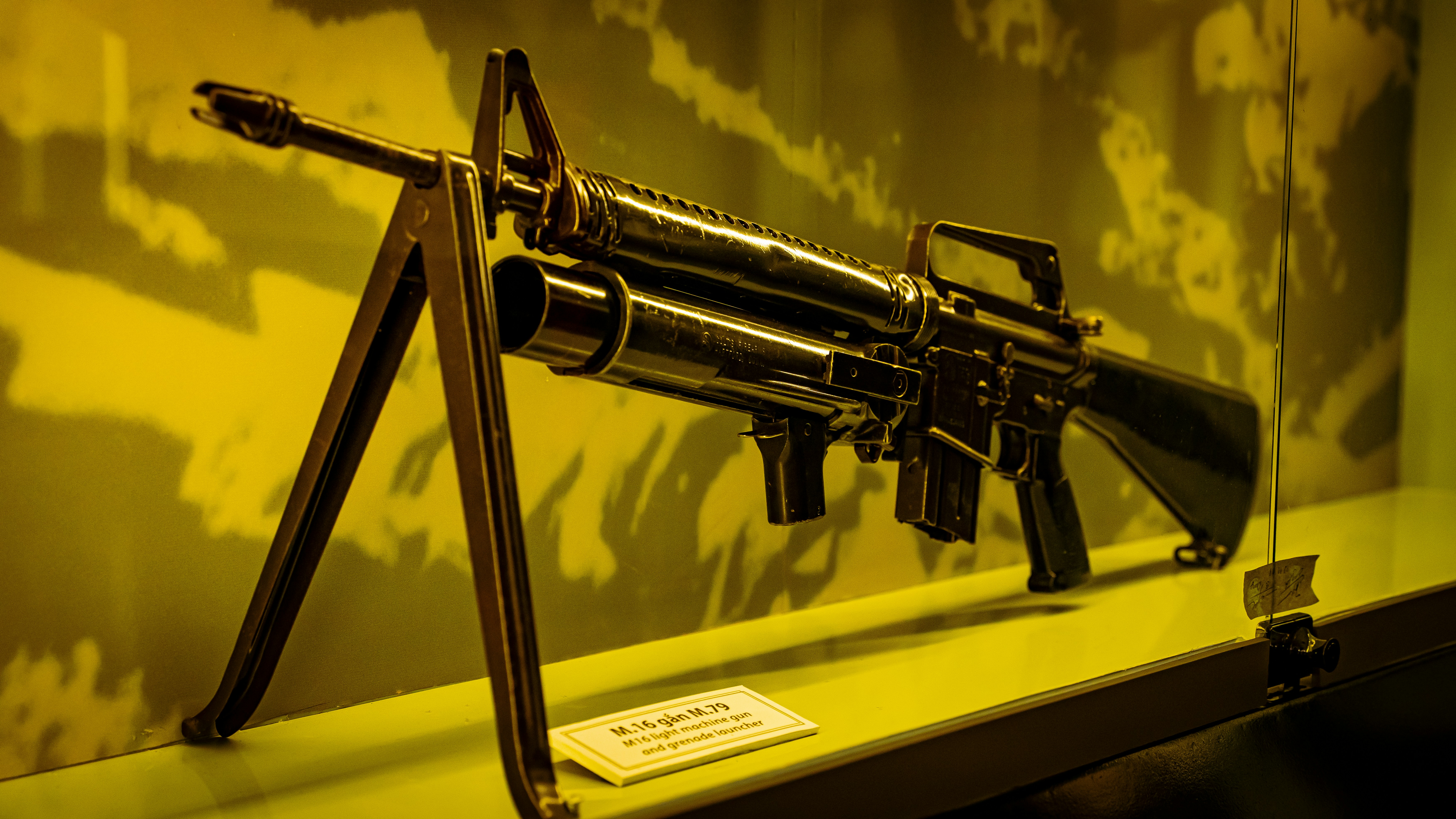 a machine gun on display in a museum