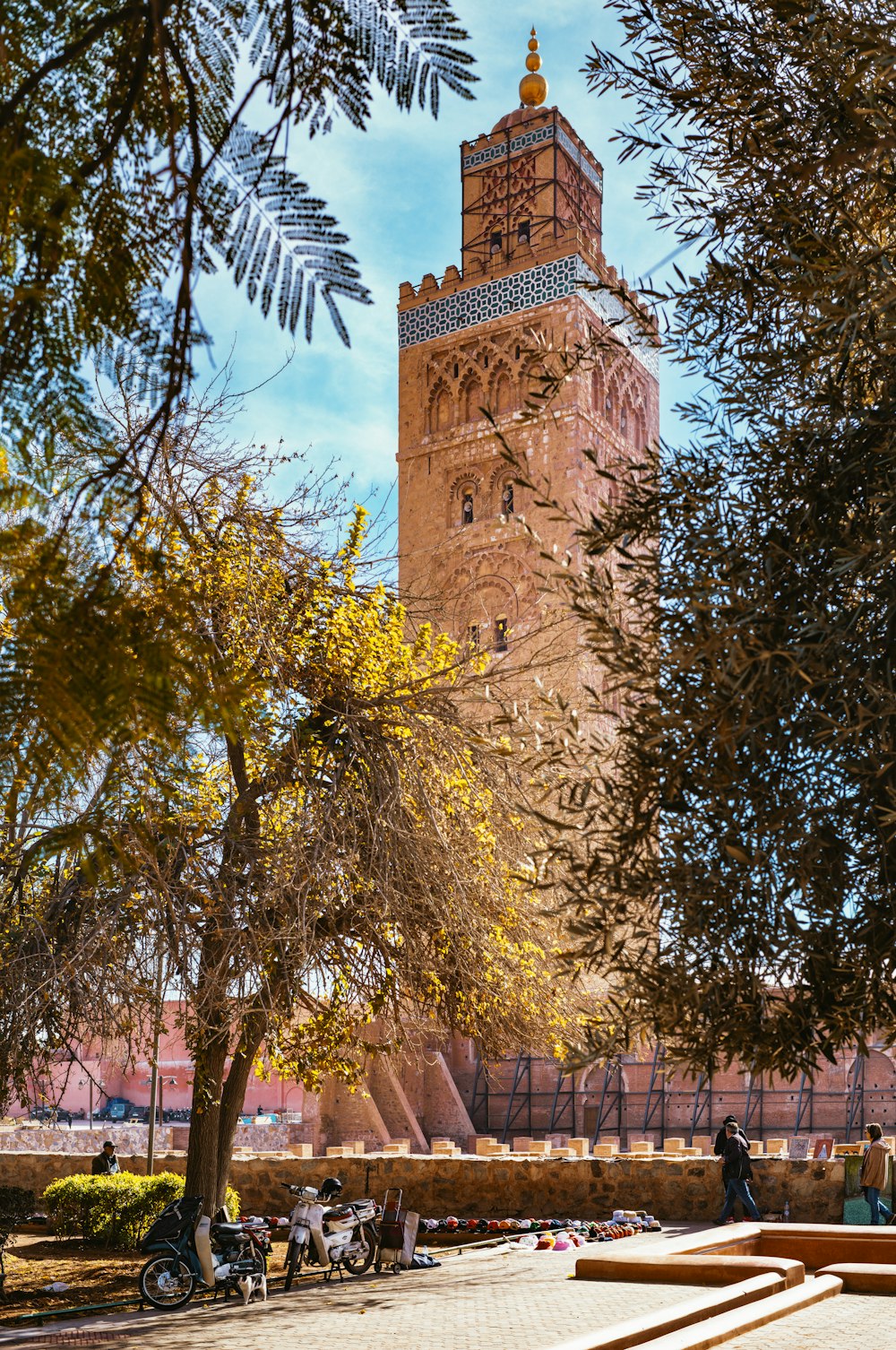 a very tall tower with a clock on it's side