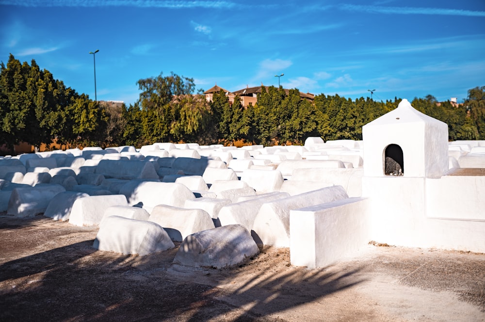 a bunch of cement blocks sitting on top of a dirt field