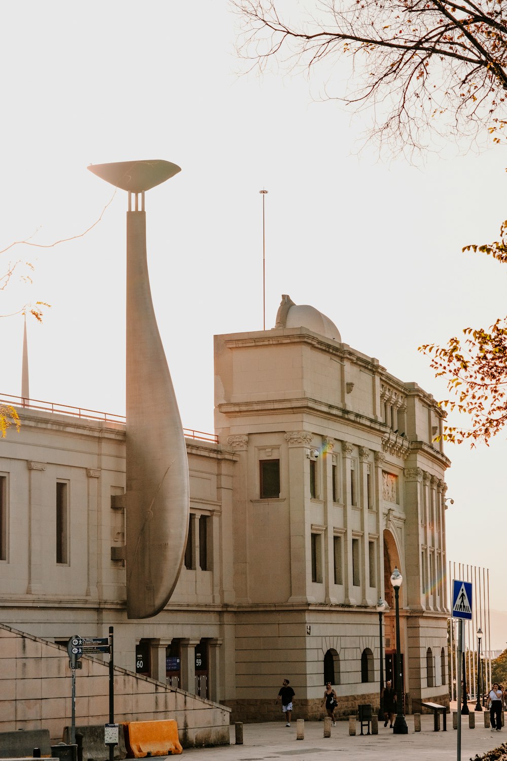 a large building with a large sculpture in front of it