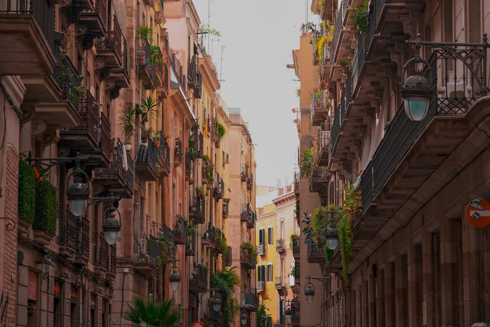 a narrow city street lined with tall buildings