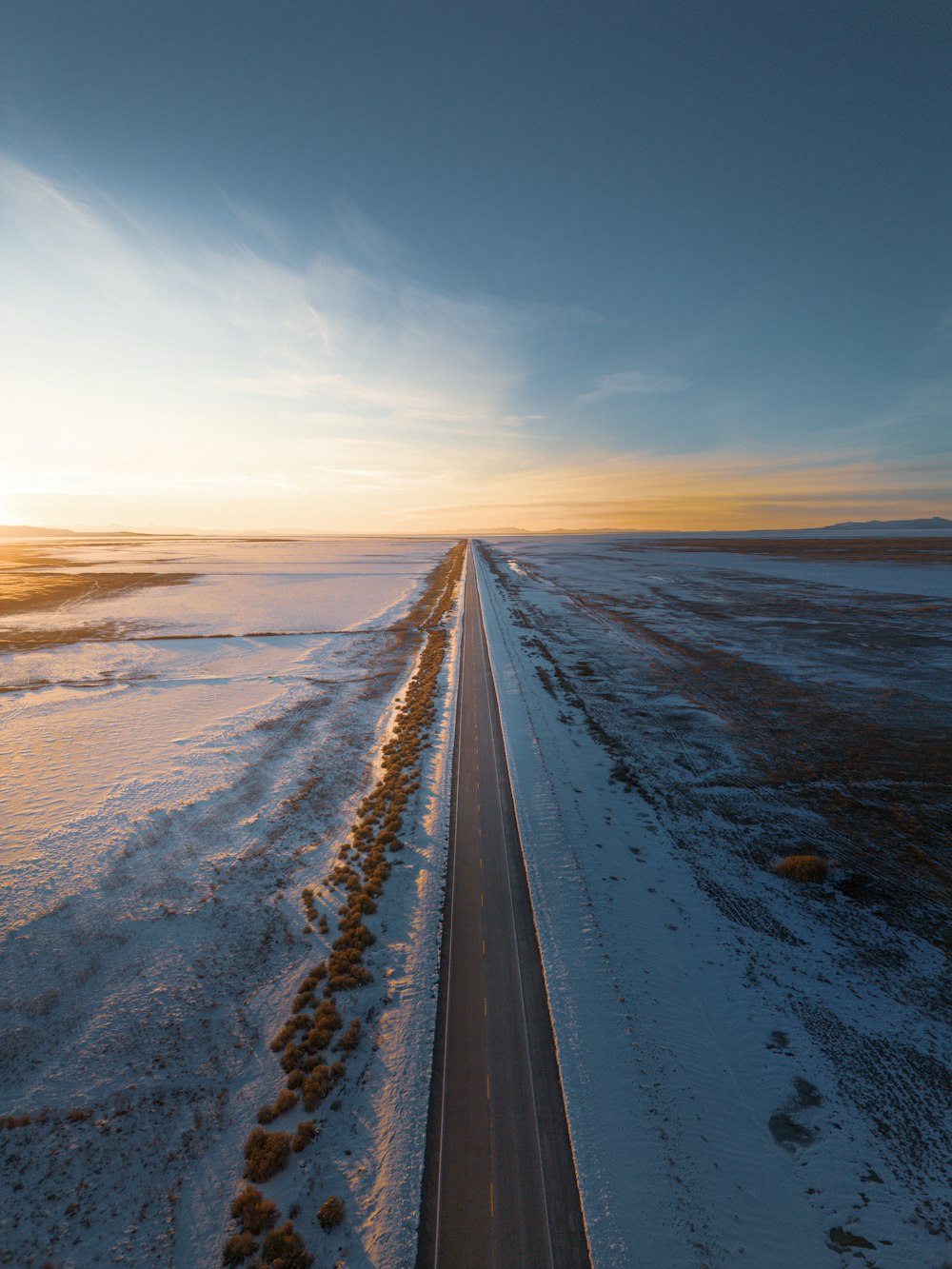 an aerial view of a road in the middle of nowhere