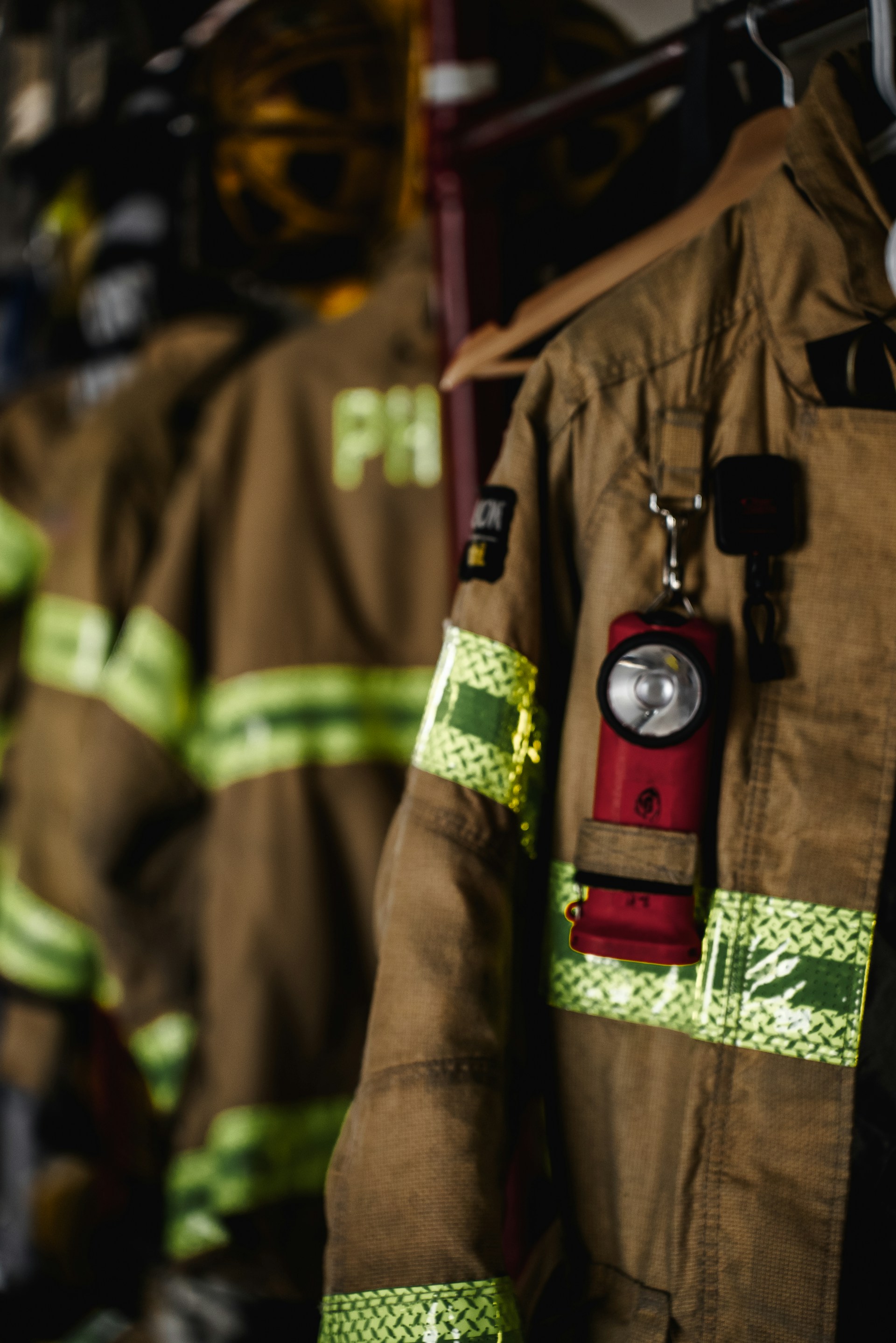 a fireman's uniform hanging on a rack