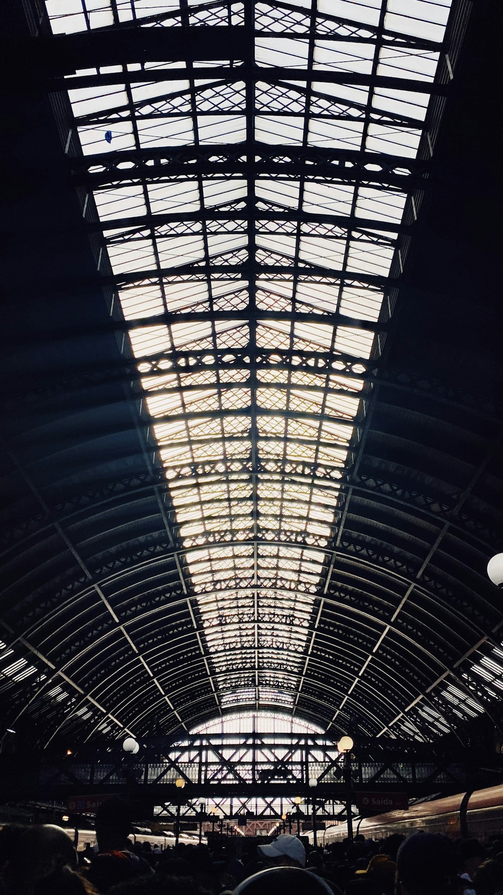 the ceiling of a train station is lit up