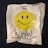 a white bag with a smiley face drawn on it