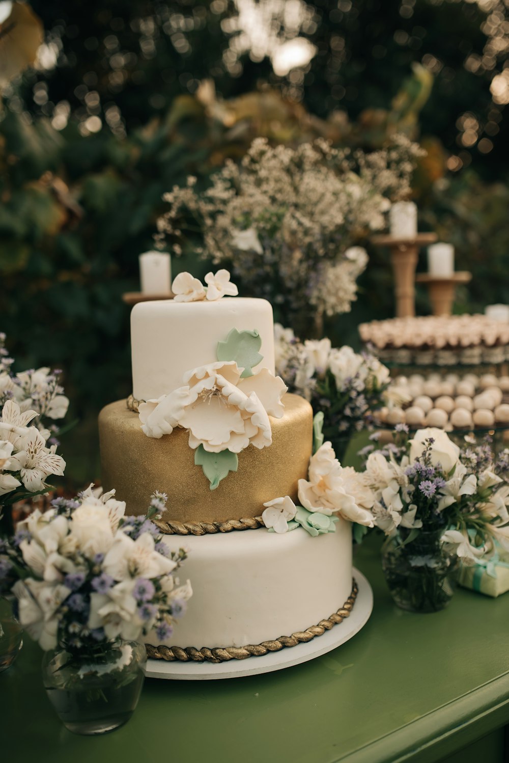 a wedding cake with flowers on a table