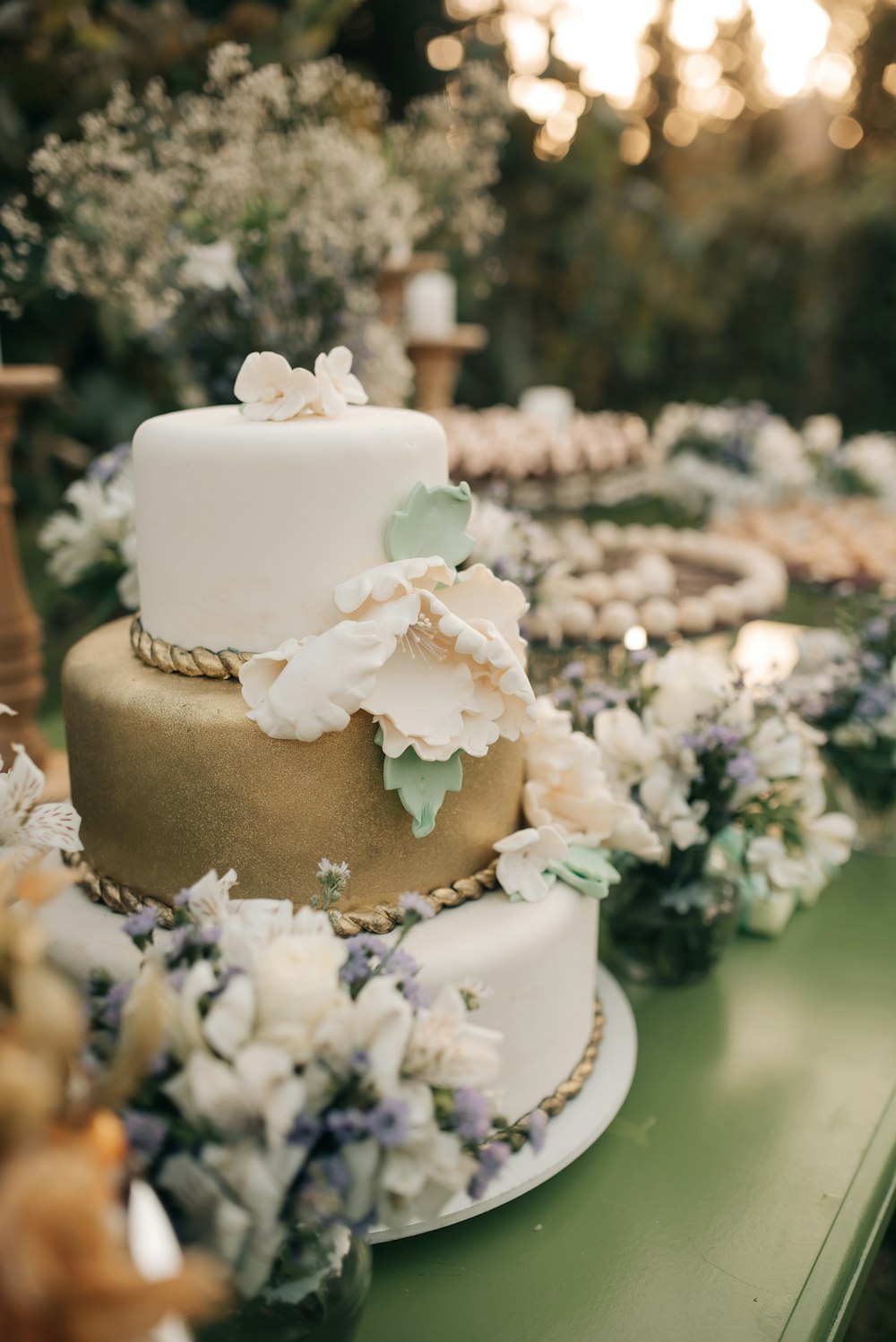 a wedding cake with flowers on a table