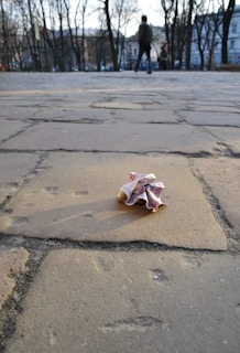 a crumpled piece of paper sitting on the ground