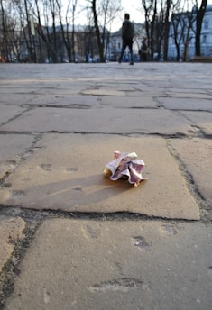 a crumpled piece of paper sitting on the ground