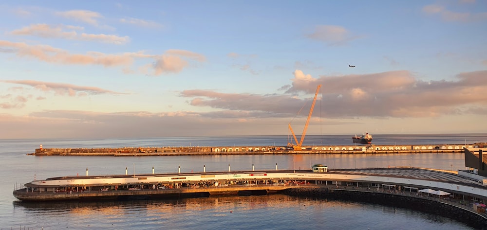 a large body of water next to a pier