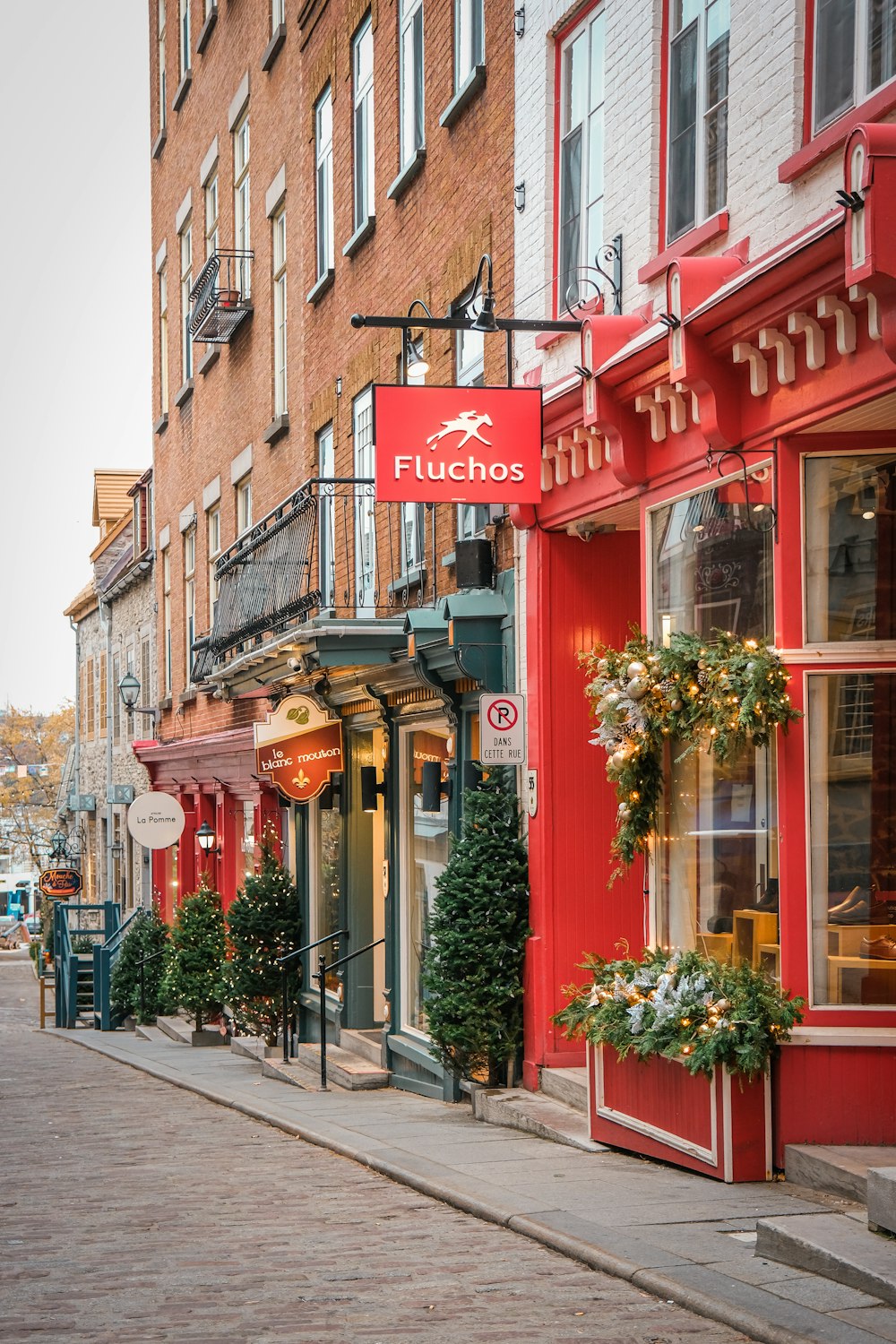 a row of buildings on a city street