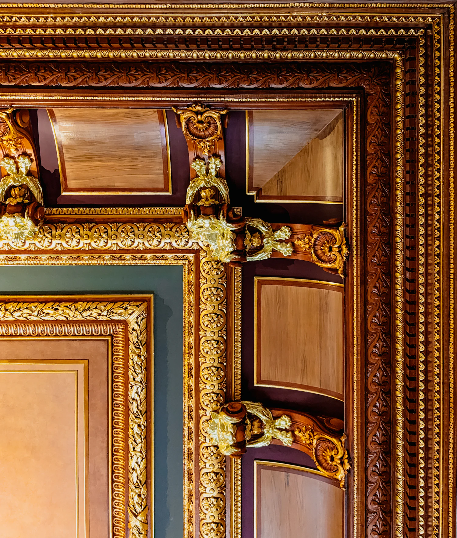 The carved and gilded corner of an ornate picture frame