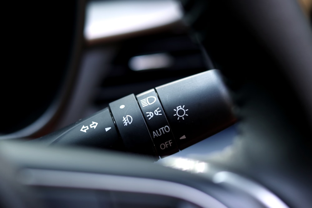 a close up of the buttons on a car's steering wheel