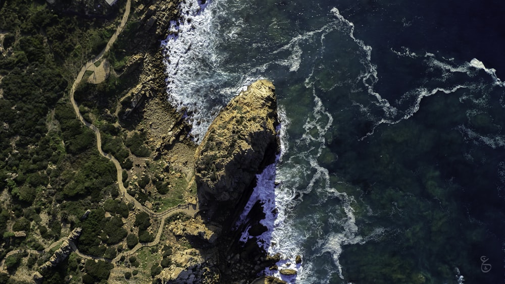 an aerial view of the ocean and land