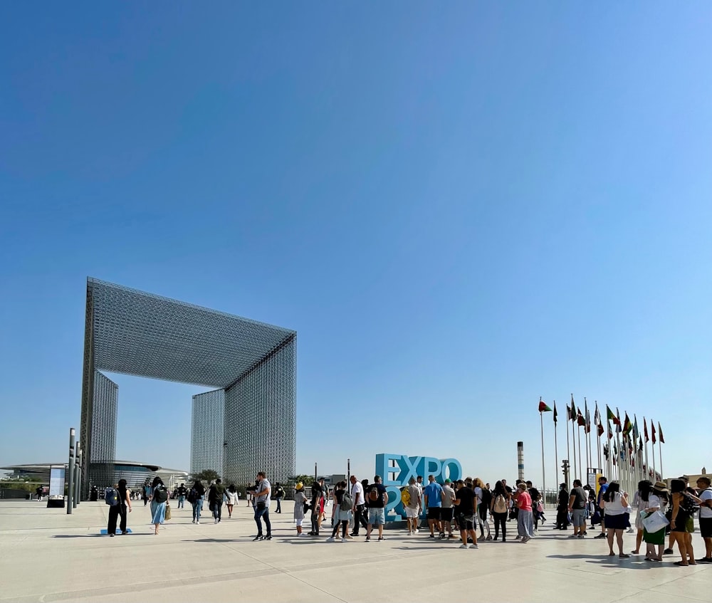 a group of people standing in front of a building