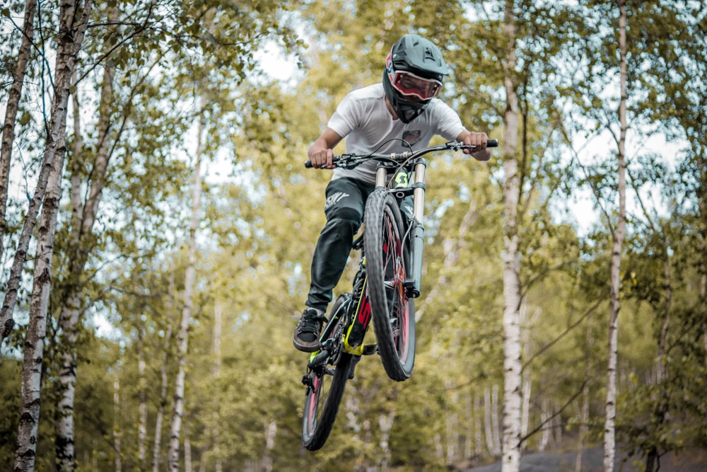 a person jumping a bike in the air