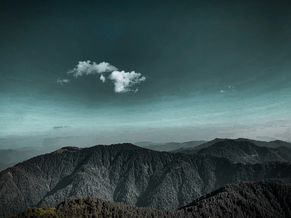 a black and white photo of a mountain range