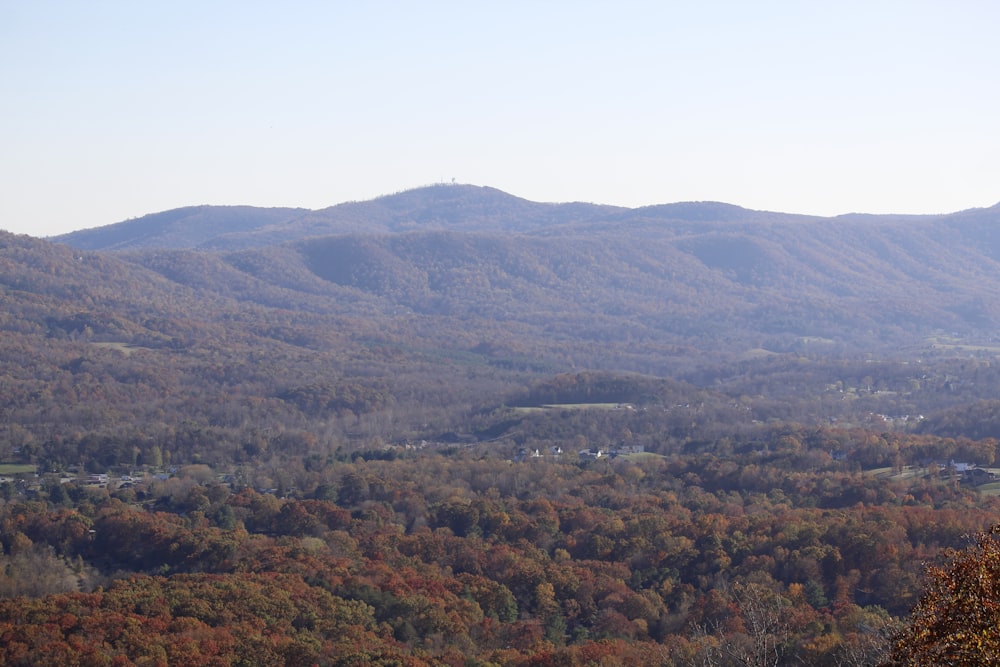 a scenic view of a mountain range in the fall