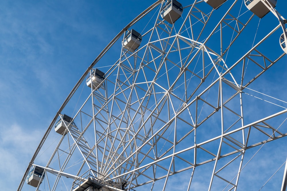 a large metal ferris wheel against a blue sky