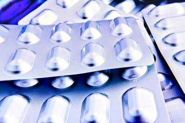 a close up of many pills in a blister