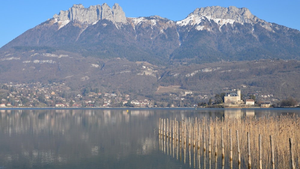 a body of water with mountains in the background