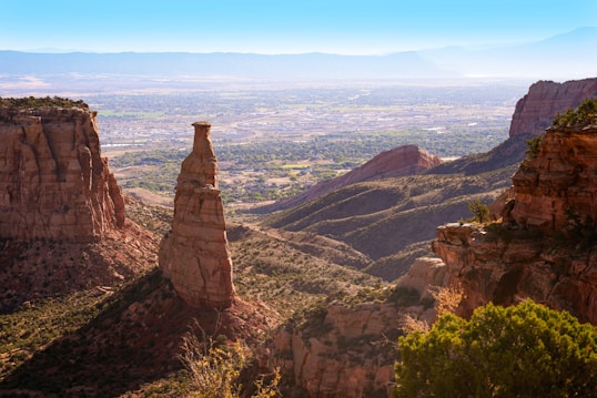 a view of a valley and mountains from a high point of view