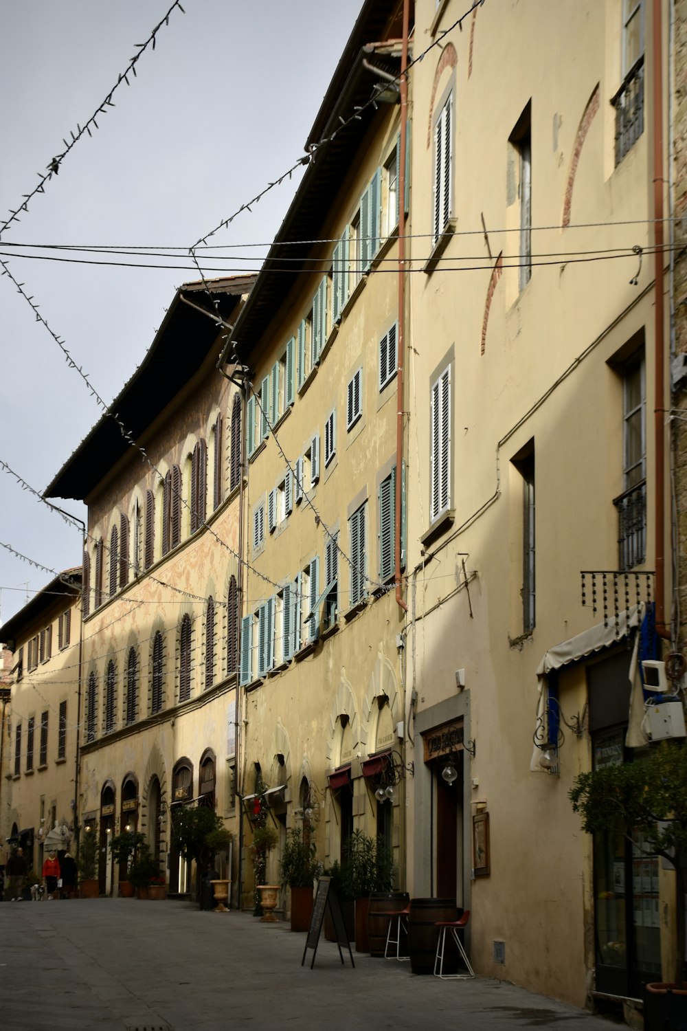 a row of buildings next to each other on a street