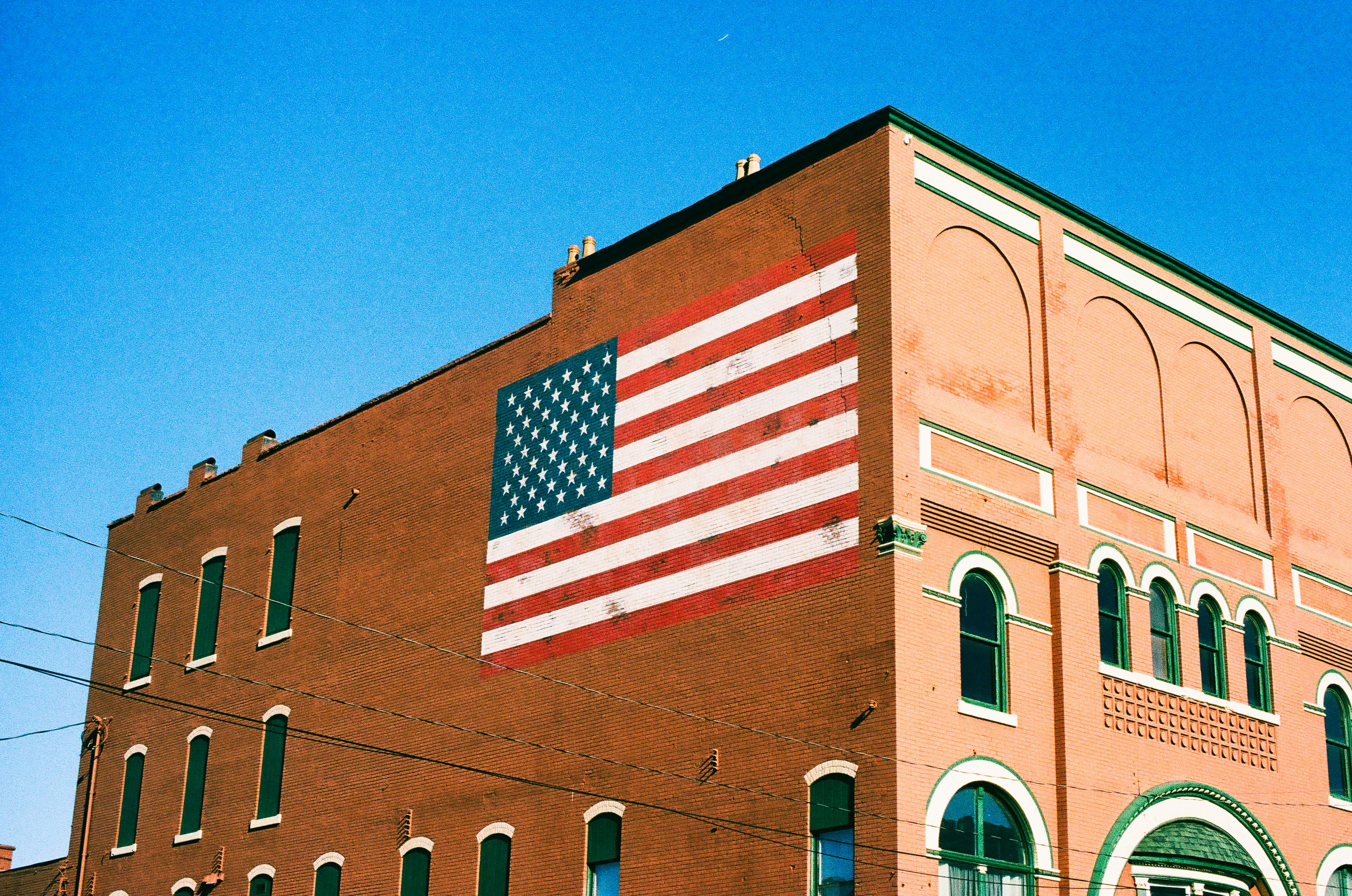 an american flag painted on the side of a building