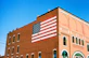 an american flag painted on the side of a building