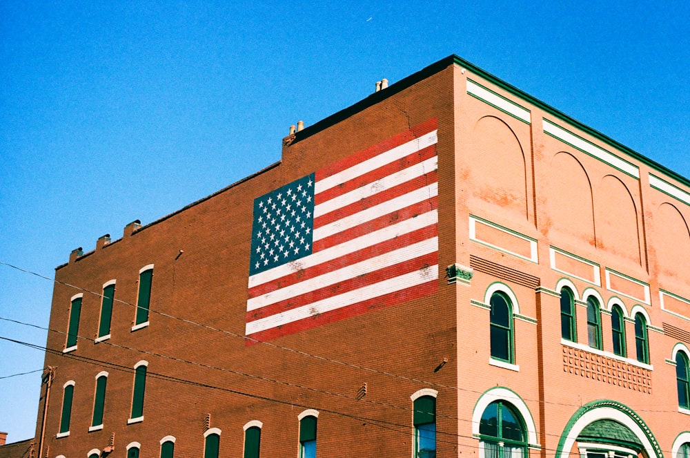 an american flag painted on the side of a building